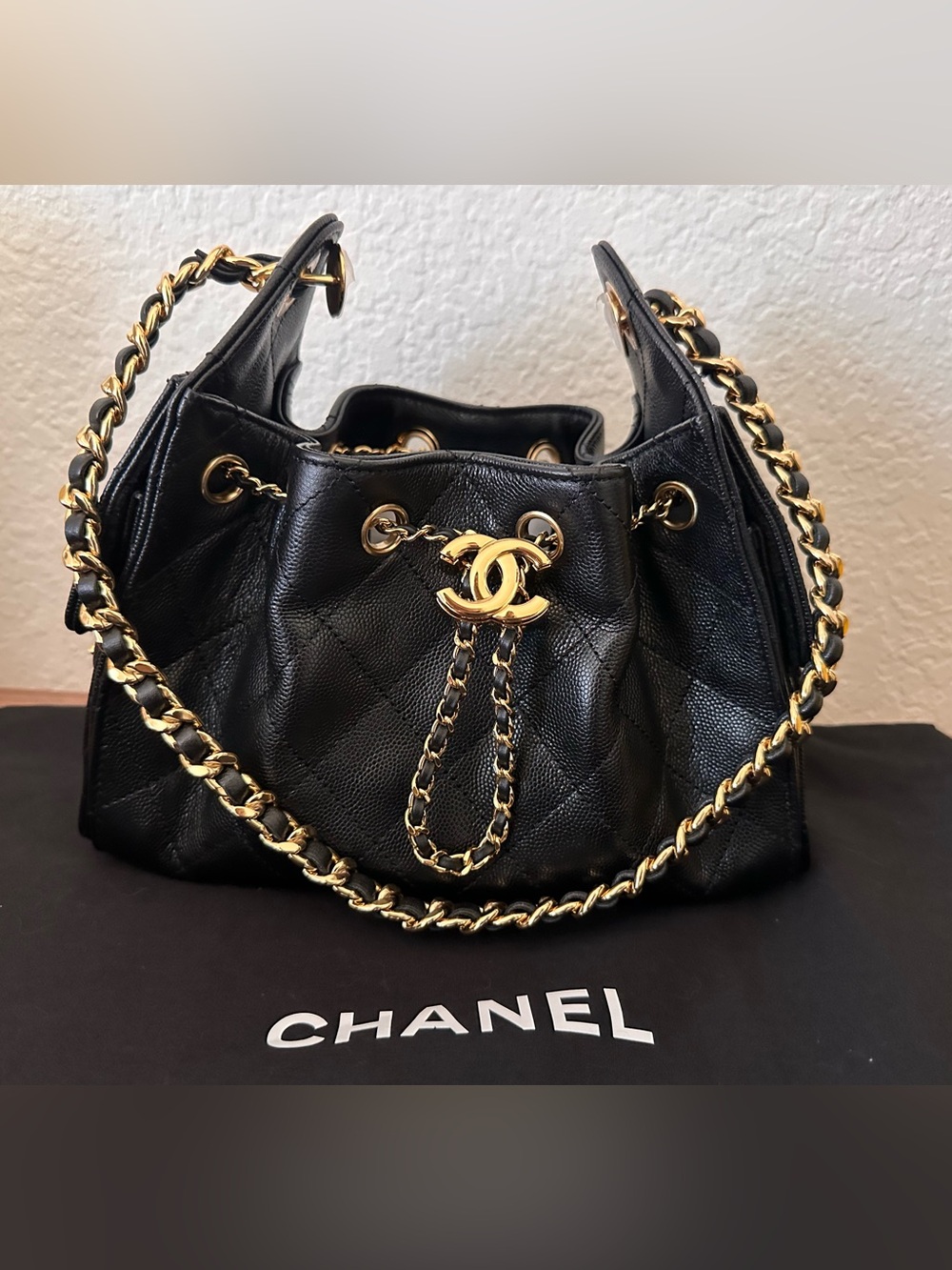 CHANEL 25 Mini Black Quilted Leather Drawstring Bucket Bag with Gold Hardware